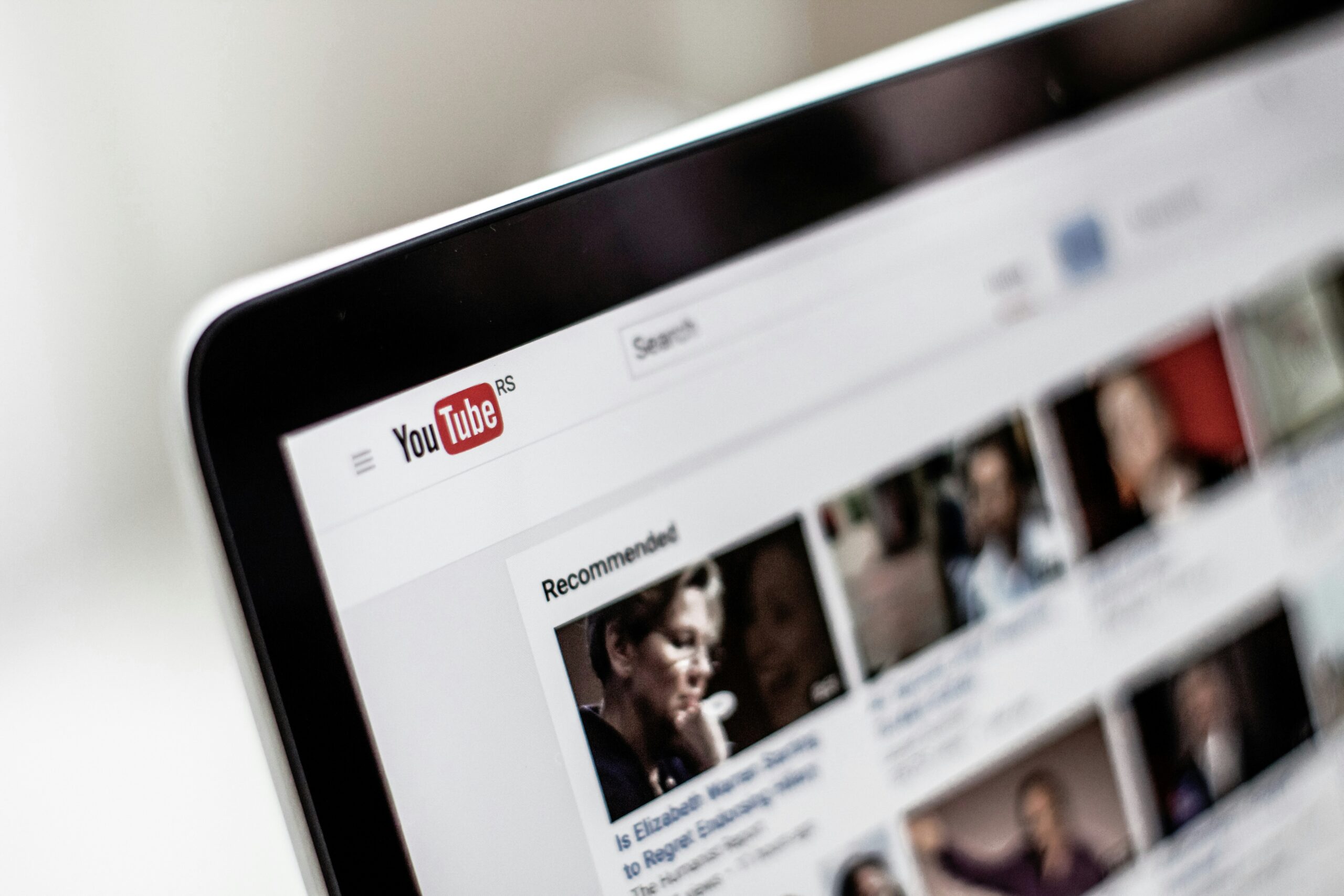 YouTube Channel Setup Service Professional set up for a new YouTube channel on a laptop with a clean modern workspace and brand assets ready